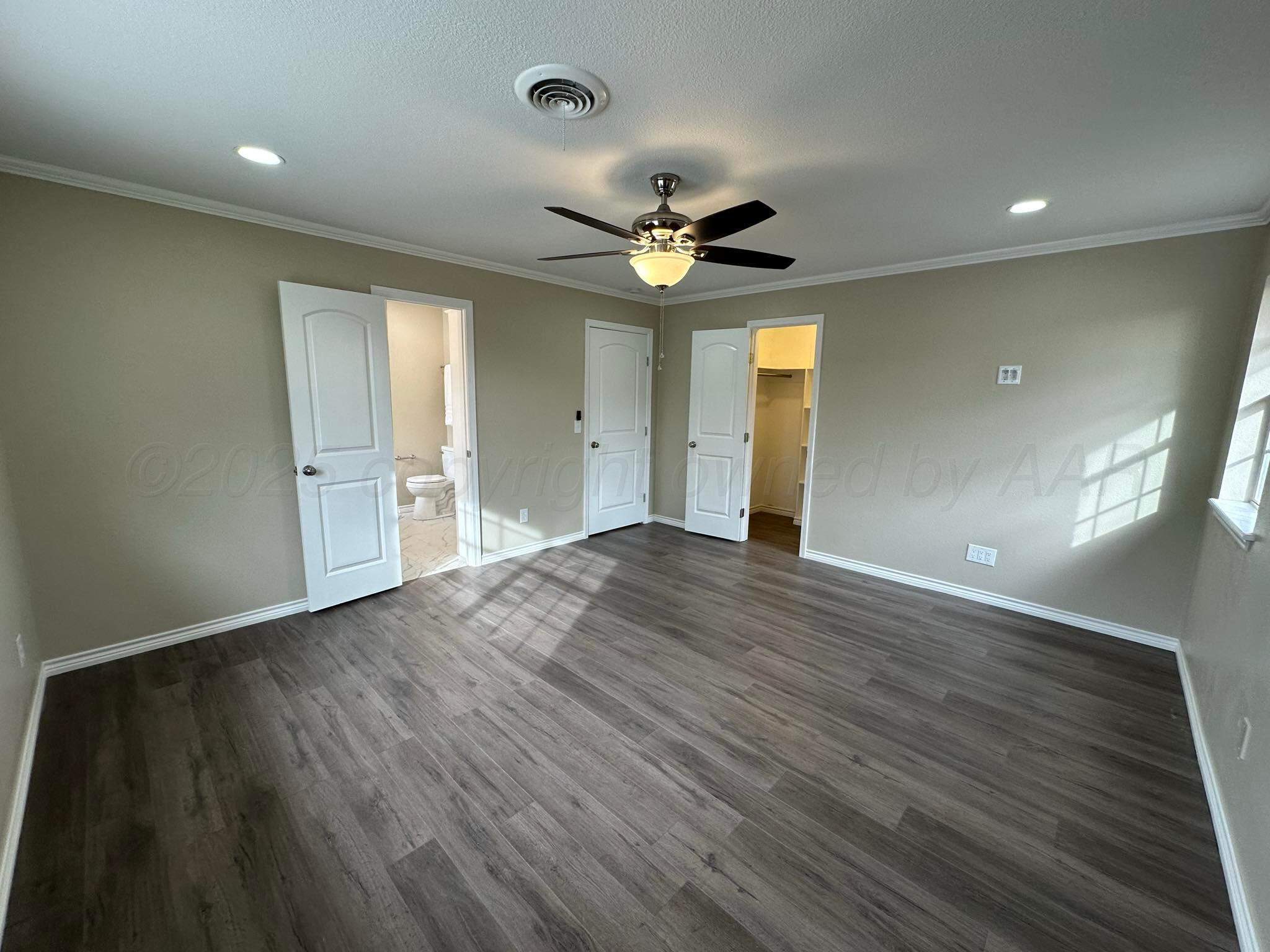 4402 Gary Lane Amarillo, TX 79110 - Photo 17 of 19 wooden floor in an empty room with a window