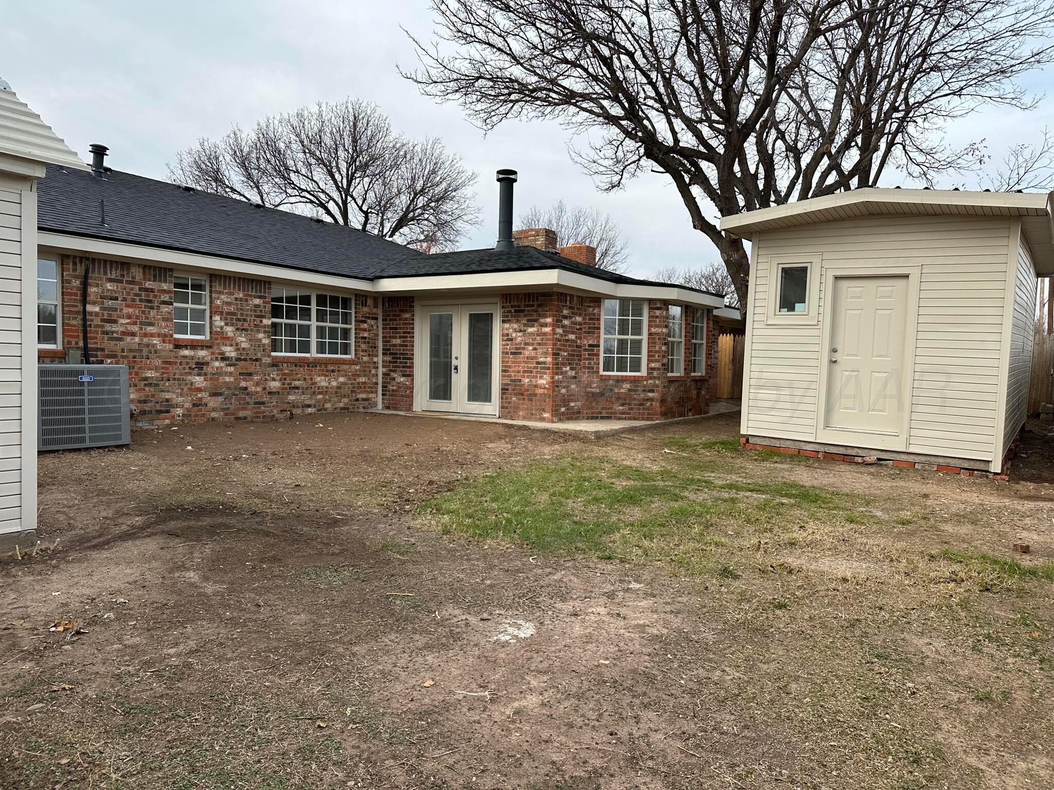 4402 Gary Lane Amarillo, TX 79110 - Photo 19 of 19 a view of a house with a yard