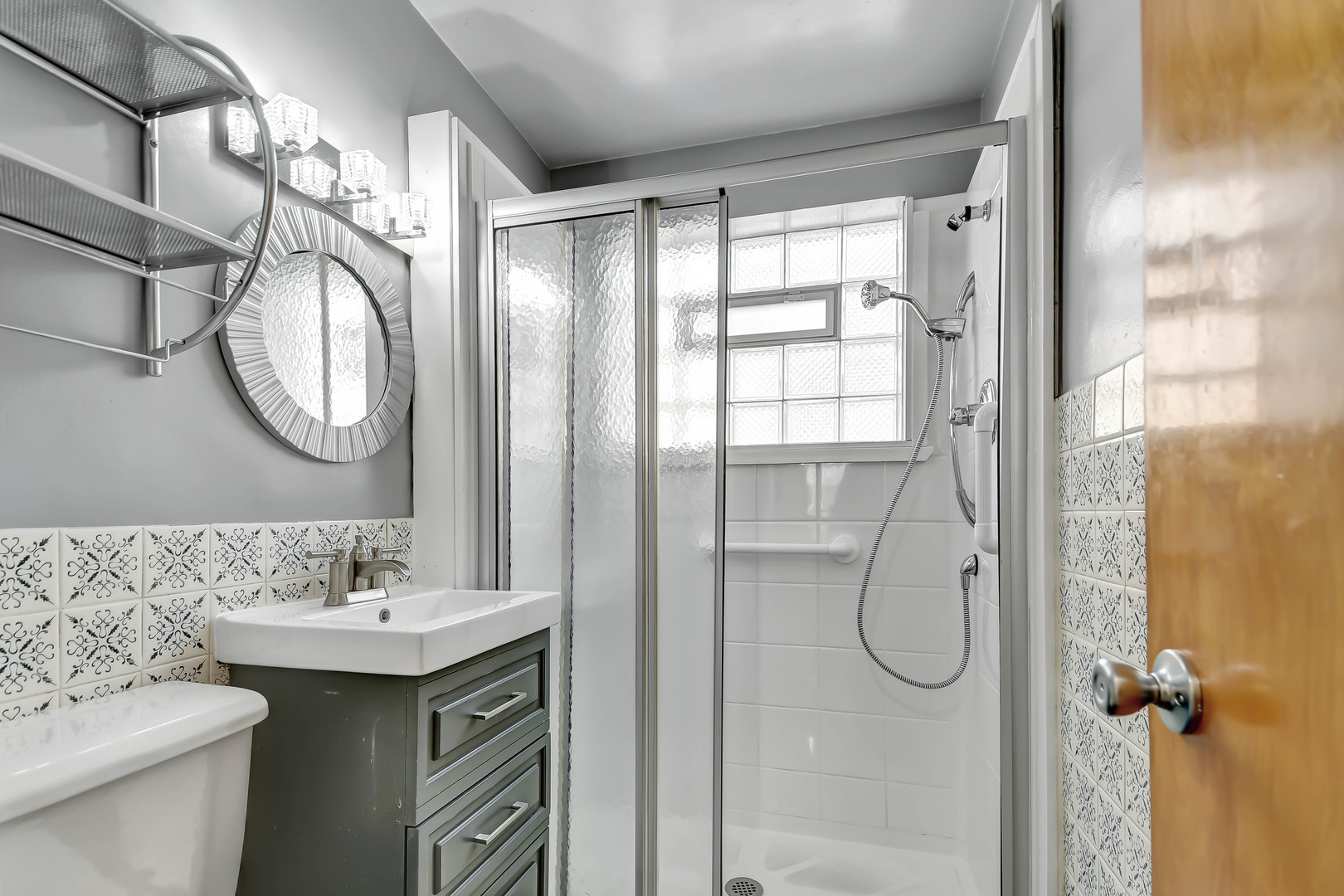 5927 West 64th Place Chicago, IL 60638 - Photo 12 of 23 a bathroom with a sink a toilet and shower