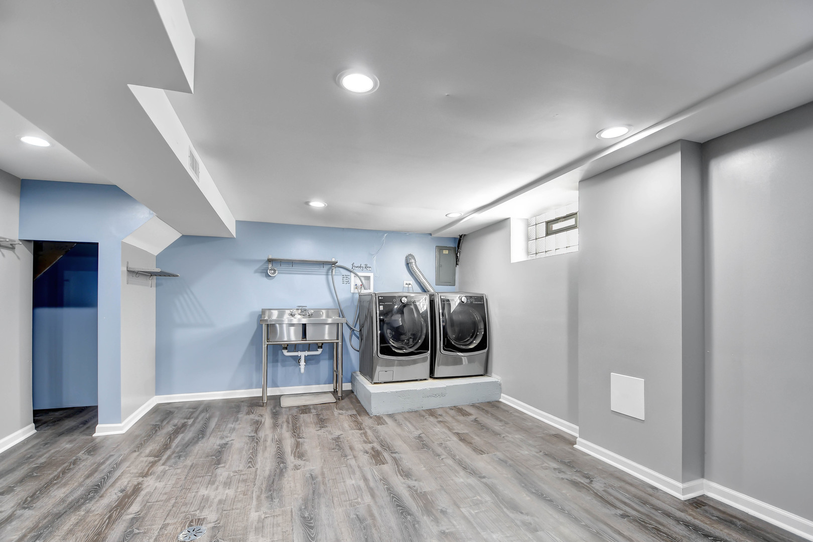 5927 West 64th Place Chicago, IL 60638 - Photo 17 of 23 a view of a big room with wooden floor and a ceiling fan