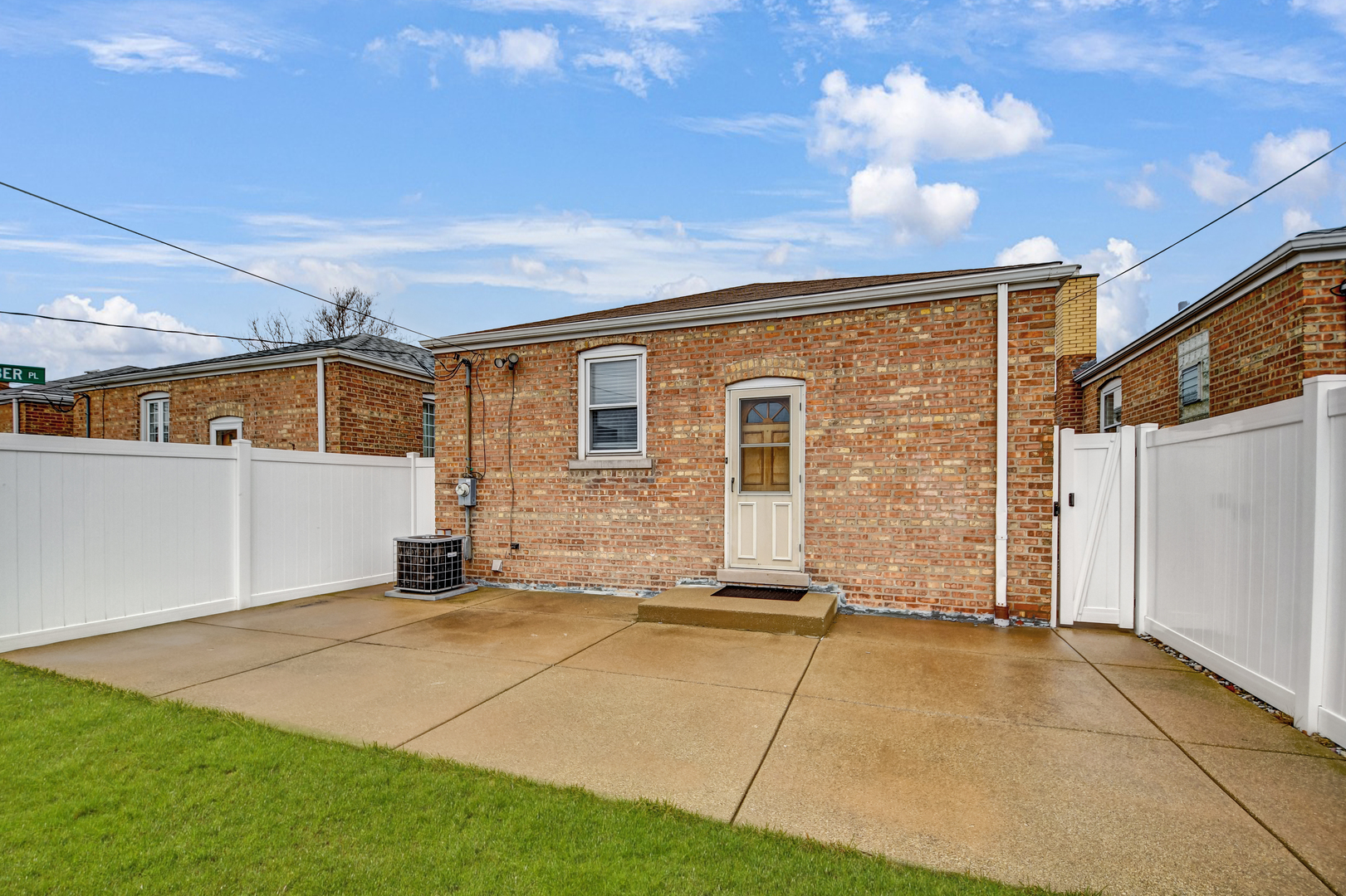 5927 West 64th Place Chicago, IL 60638 - Photo 21 of 23 a backyard of a house with table and chairs