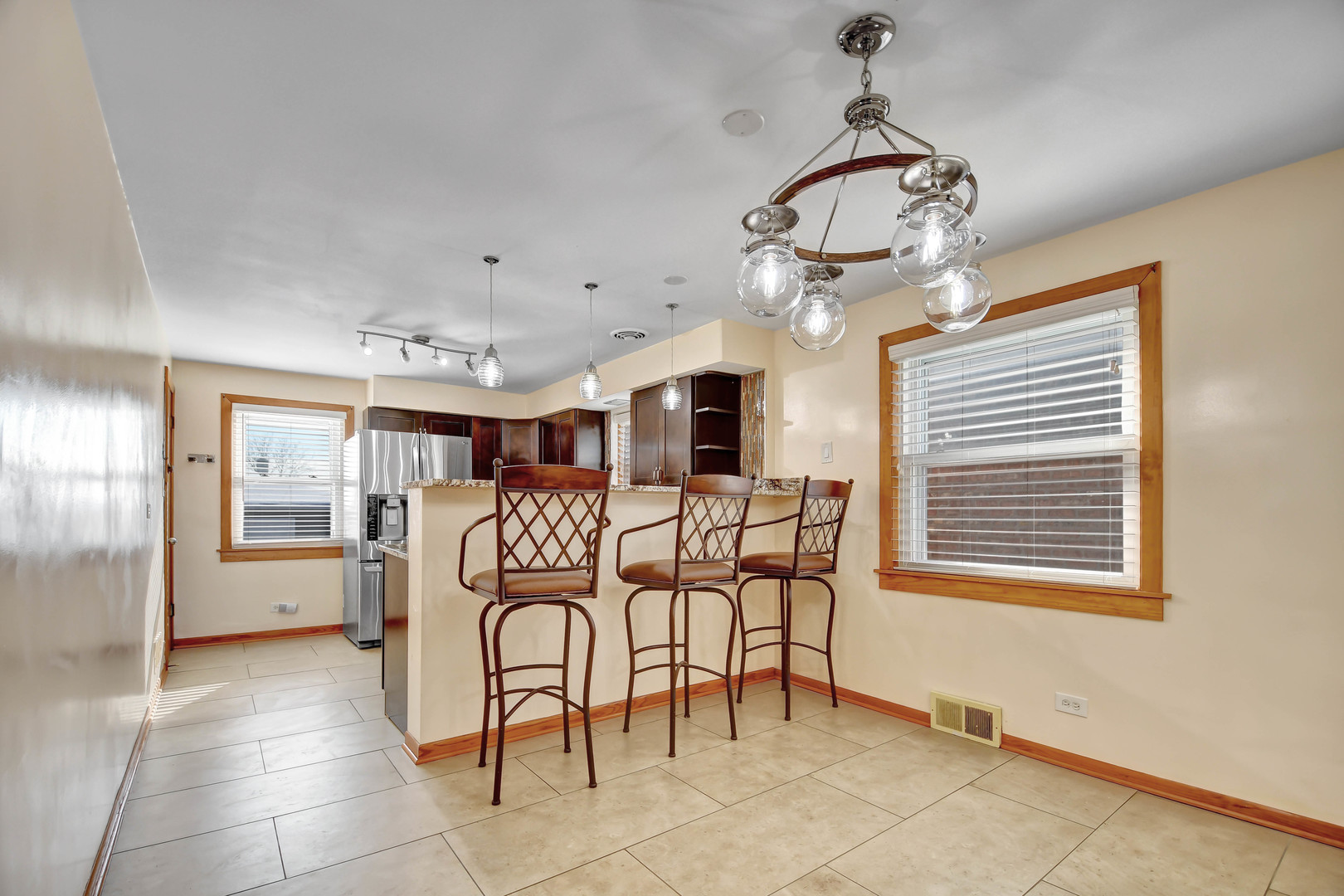 5927 West 64th Place Chicago, IL 60638 - Photo 4 of 23 a view of a livingroom with furniture window and wooden floor
