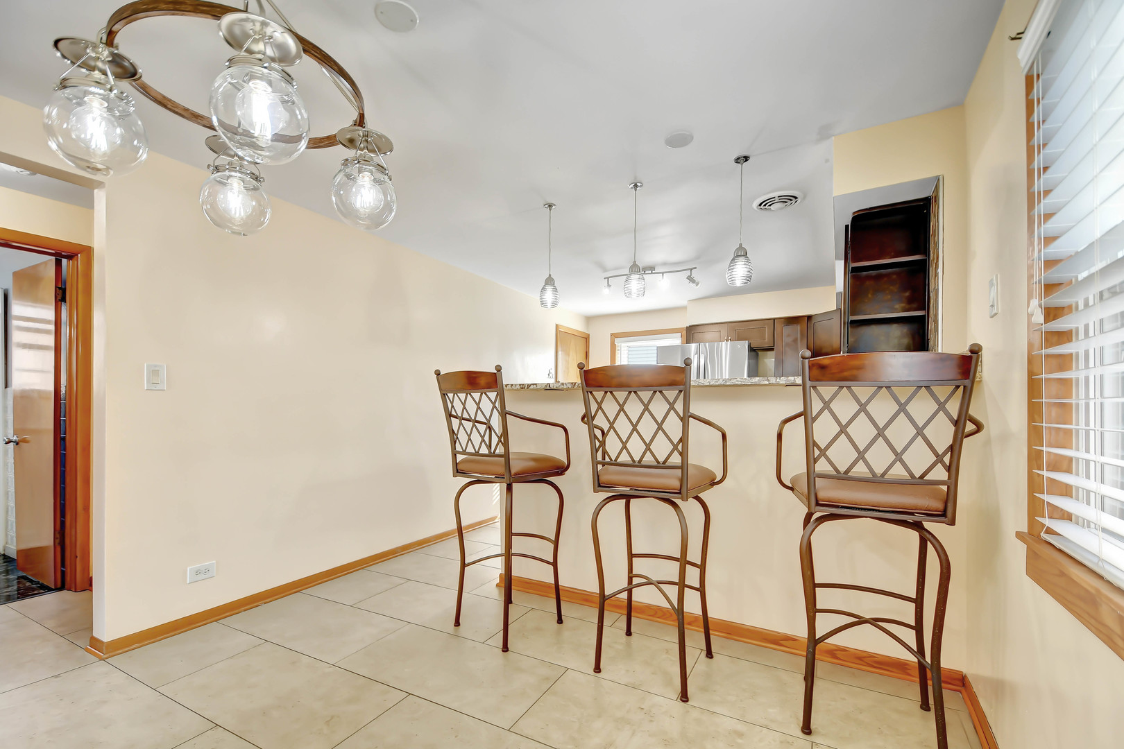 5927 West 64th Place Chicago, IL 60638 - Photo 6 of 23 a view of a dining room with furniture