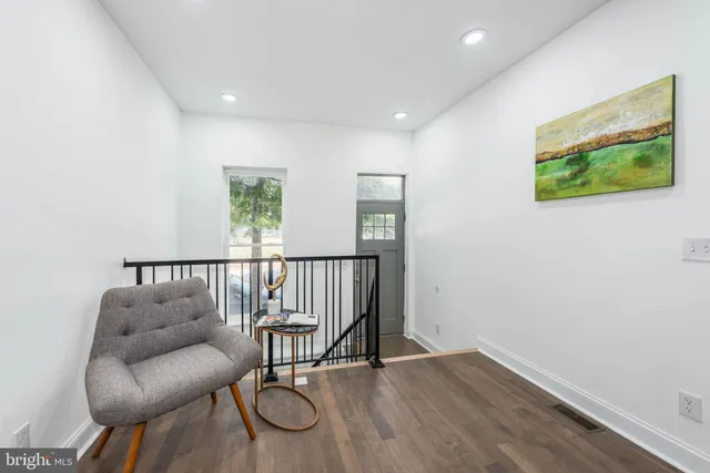 a view of a livingroom with furniture and window