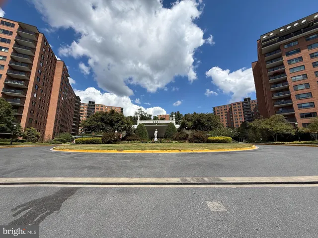 a view of a swimming pool with building in front of it
