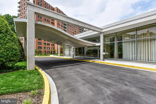a view of swimming pool with a patio and a yard