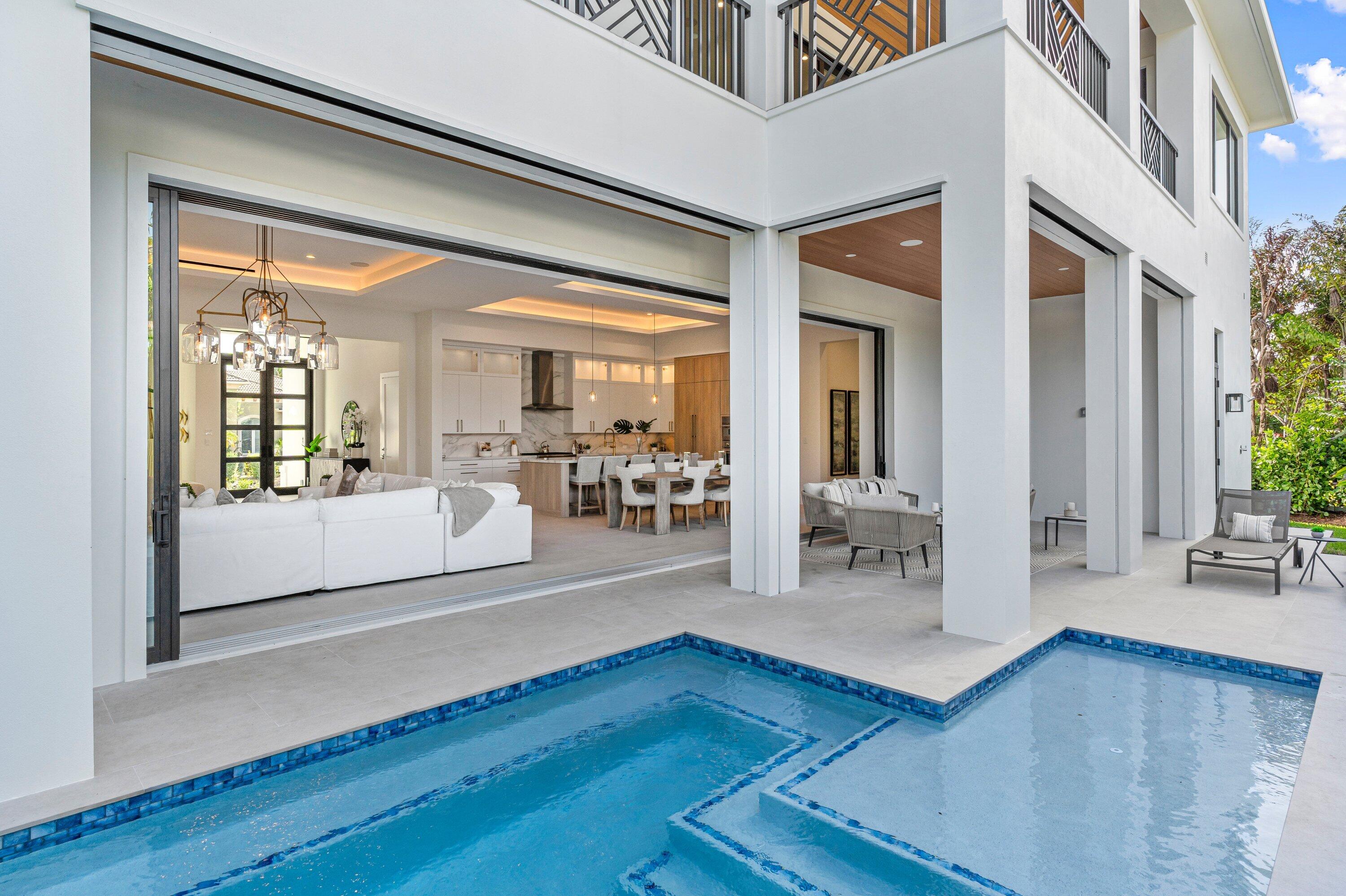 2609 Northeast 27th Way Fort Lauderdale, FL 33306 - Photo 21 of 53 a living room with furniture and a table
