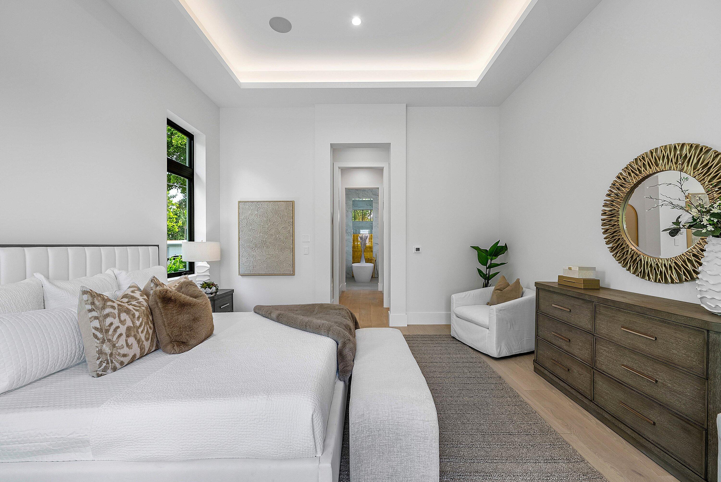 2609 Northeast 27th Way Fort Lauderdale, FL 33306 - Photo 26 of 53 a bed room with a bed and a chair