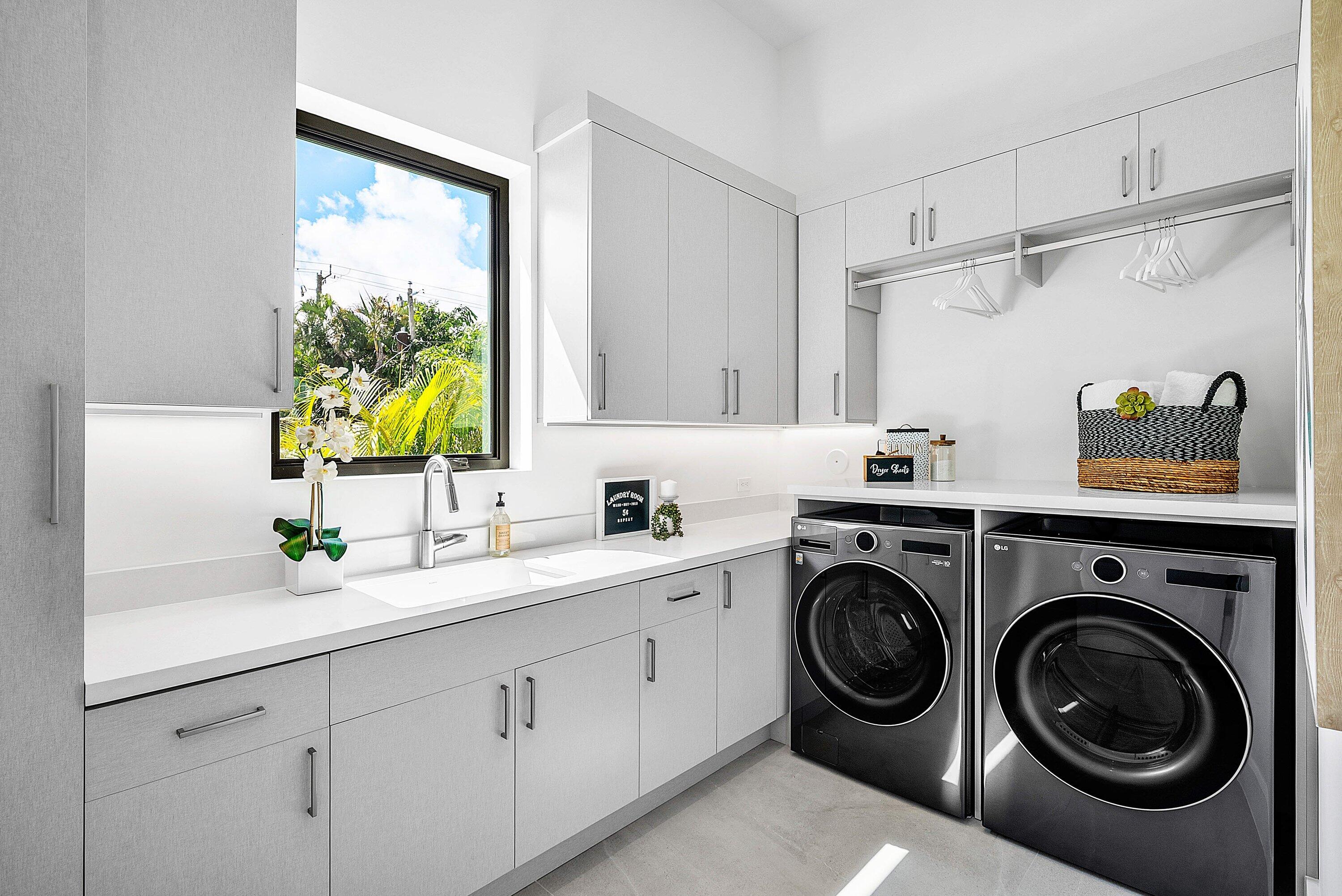 2609 Northeast 27th Way Fort Lauderdale, FL 33306 - Photo 31 of 53 a utility room with sink dryer and washer