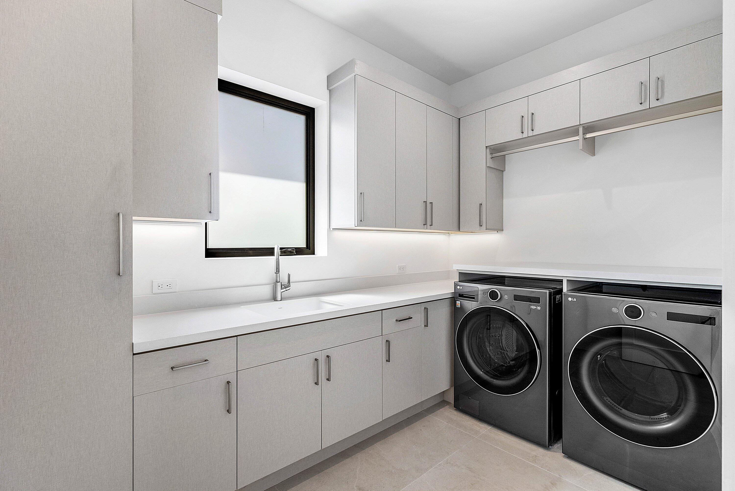 2609 Northeast 27th Way Fort Lauderdale, FL 33306 - Photo 34 of 53 a utility room with sink dryer and washer