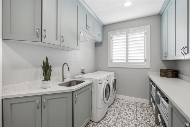 21 Pier Place Tooele, UT 84074 - Photo 39 of 112 Laundry room featuring an integrated sink, shaker-style cabinetry, and a patterned tile floor