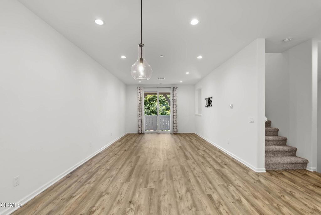 3705 Islander Walk Oxnard, CA 93035 - Photo 14 of 45 an empty room with wooden floor and windows