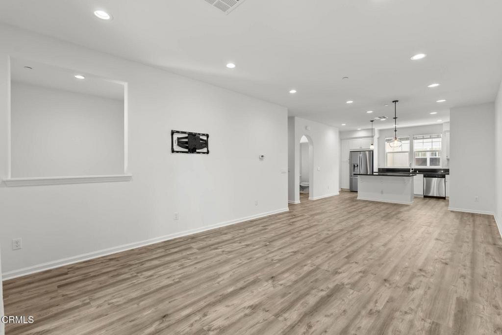 3705 Islander Walk Oxnard, CA 93035 - Photo 15 of 45 an empty room with wooden floor and windows