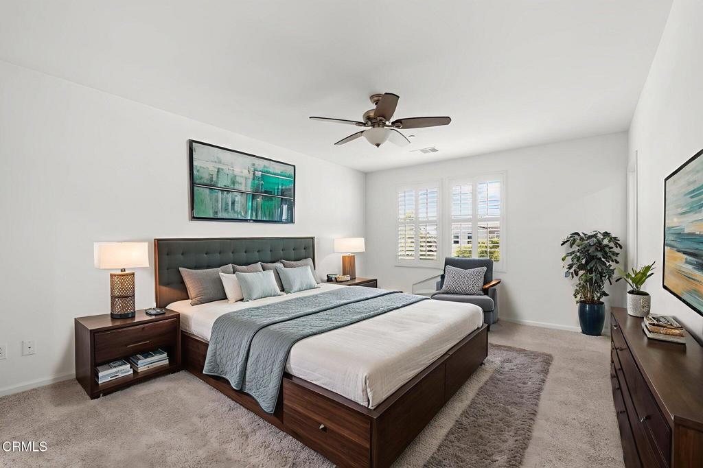3705 Islander Walk Oxnard, CA 93035 - Photo 19 of 45 a bedroom with bed and a potted plant