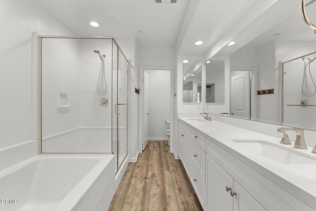 3705 Islander Walk Oxnard, CA 93035 - Photo 22 of 45 a spacious bathroom with a tub sink shower and mirror