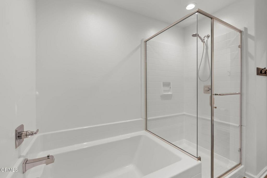 3705 Islander Walk Oxnard, CA 93035 - Photo 23 of 45 a bathroom with a shower and a glass door