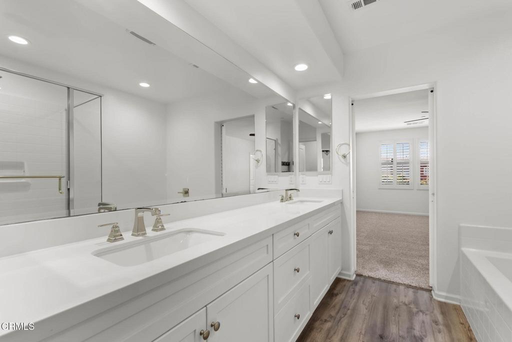 3705 Islander Walk Oxnard, CA 93035 - Photo 24 of 45 a bathroom with a double vanity sink mirror and double