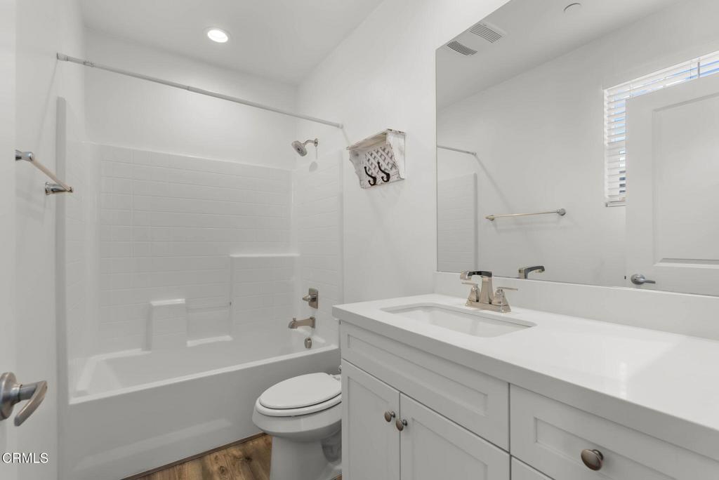 3705 Islander Walk Oxnard, CA 93035 - Photo 29 of 45 a bathroom with a sink a toilet and a bathtub