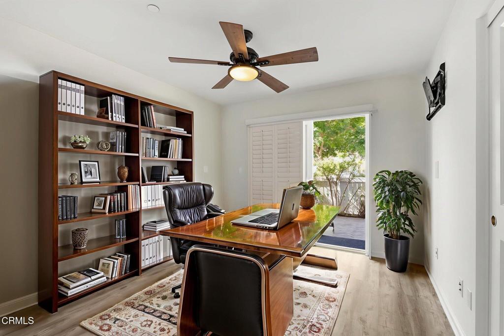 3705 Islander Walk Oxnard, CA 93035 - Photo 30 of 45 a view of a workspace with furniture and a book shelf