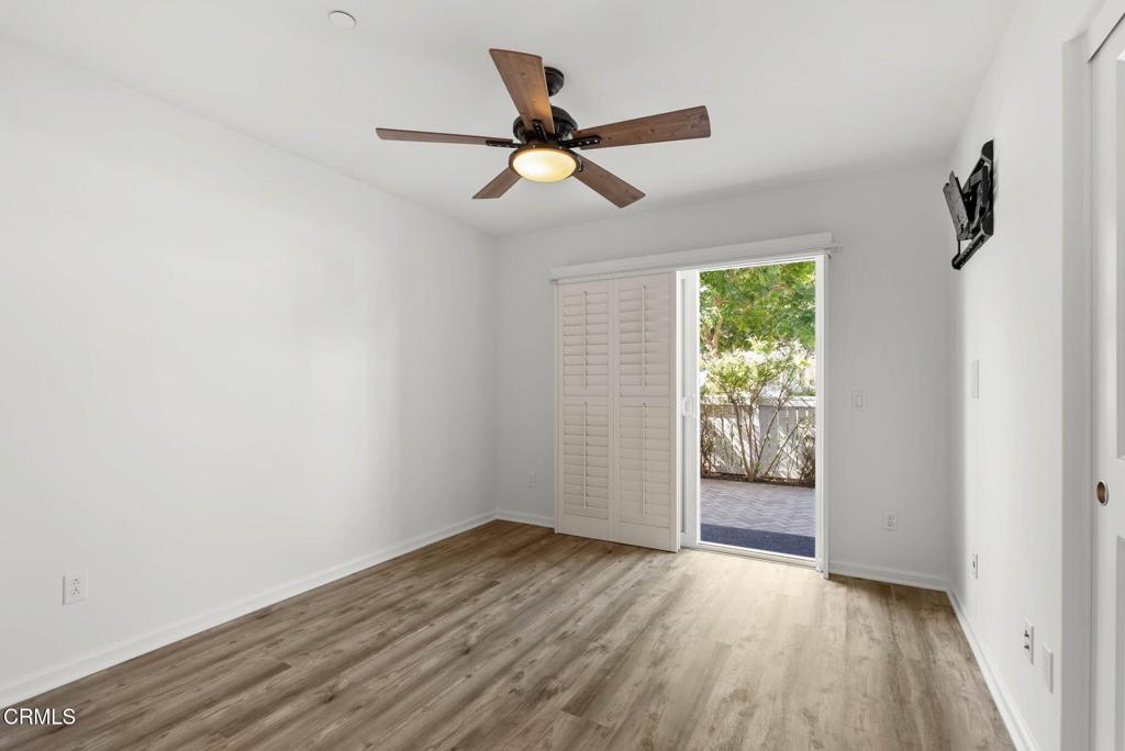 3705 Islander Walk Oxnard, CA 93035 - Photo 32 of 45 an empty room with wooden floor and windows