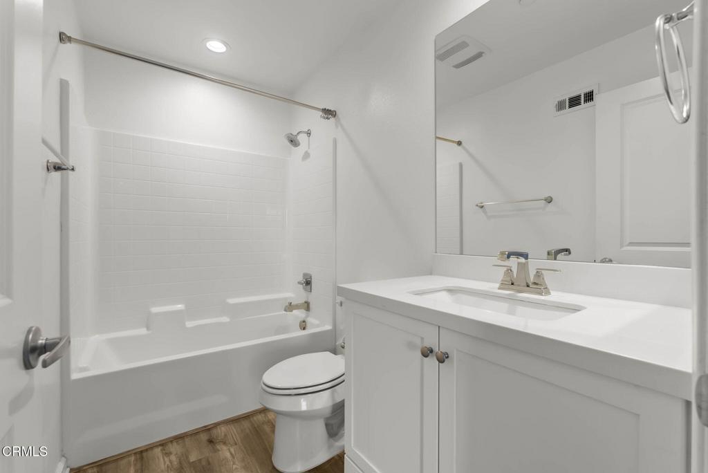 3705 Islander Walk Oxnard, CA 93035 - Photo 33 of 45 a bathroom with a sink a toilet and shower