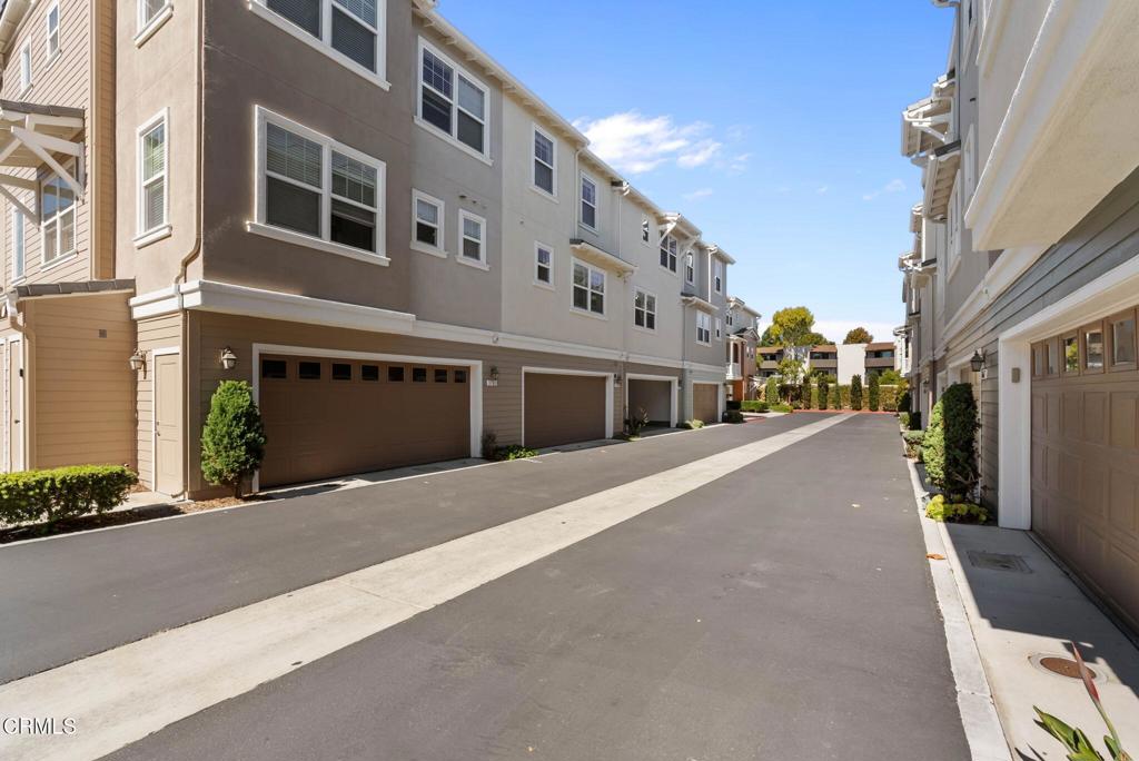 3705 Islander Walk Oxnard, CA 93035 - Photo 37 of 45 a front view of a building with a street