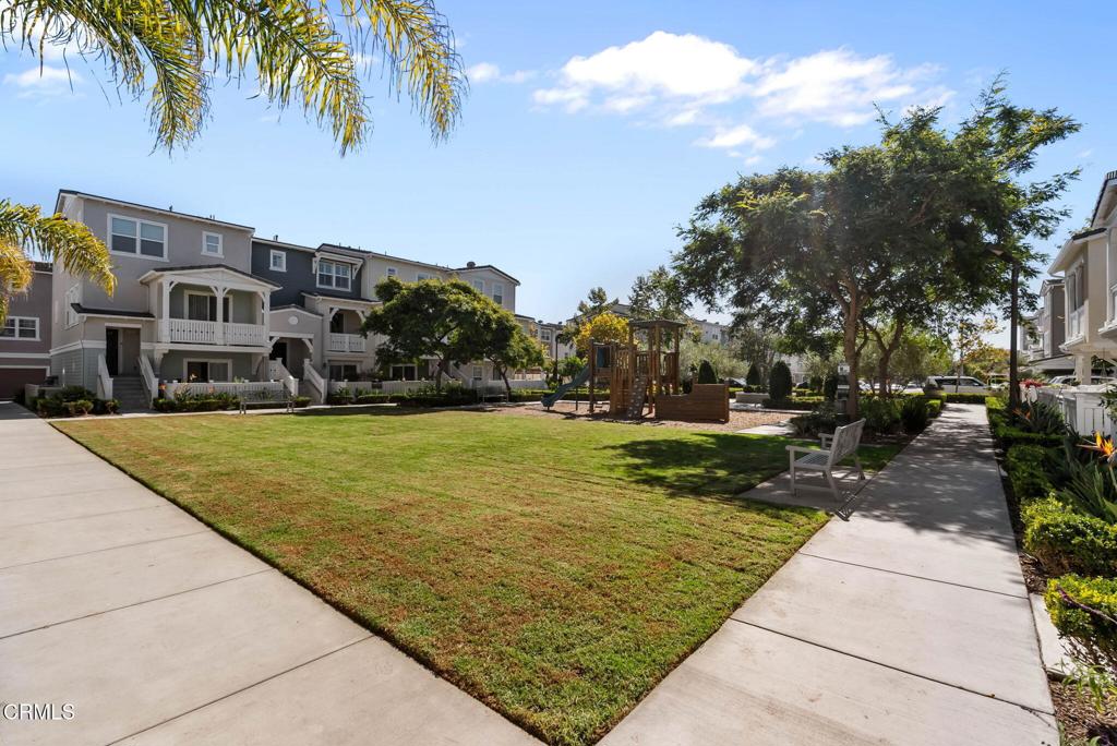 3705 Islander Walk Oxnard, CA 93035 - Photo 39 of 45 a view of swimming pool with outdoor seating and trees