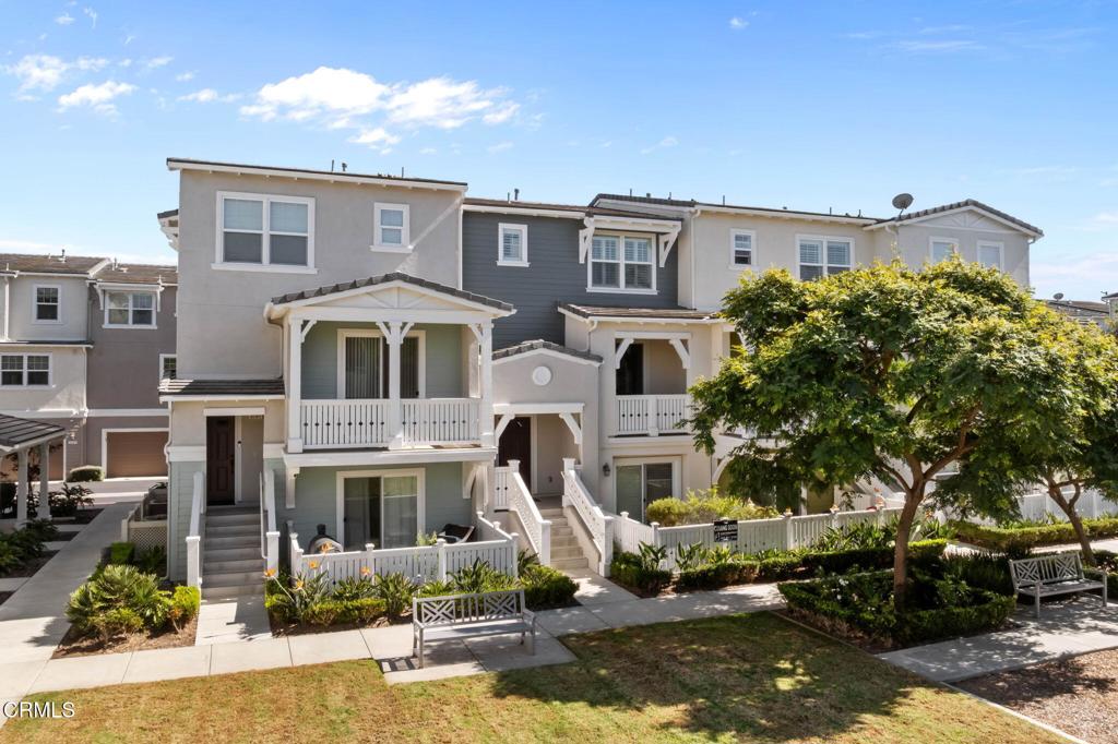 3705 Islander Walk Oxnard, CA 93035 - Photo 4 of 45 a front view of a house with a yard