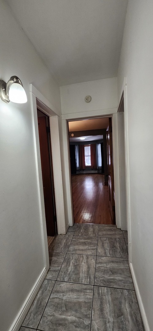 4450 West Altgeld Street, Unit 1 Chicago, IL 60639 - Photo 18 of 29 a view of entryway with wooden floor