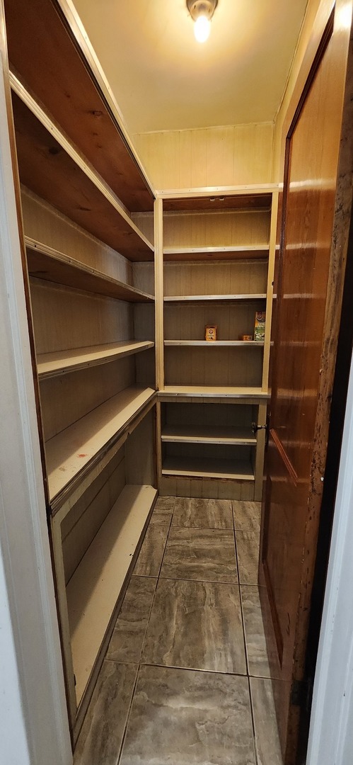 4450 West Altgeld Street, Unit 1 Chicago, IL 60639 - Photo 20 of 29 a view of walk in closet with empty racks