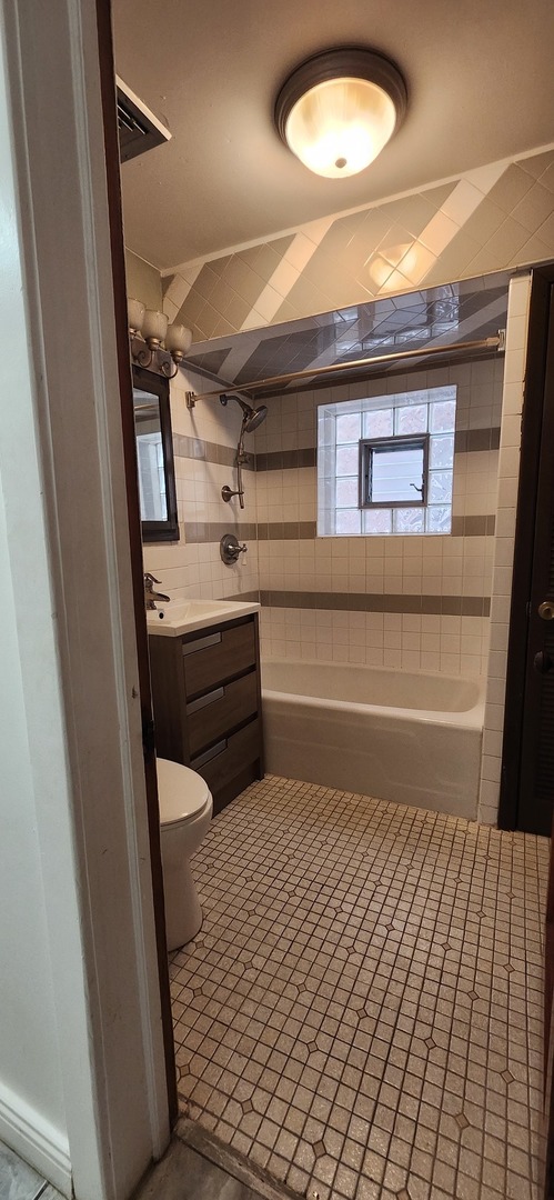 4450 West Altgeld Street, Unit 1 Chicago, IL 60639 - Photo 24 of 29 a room with storage and utility