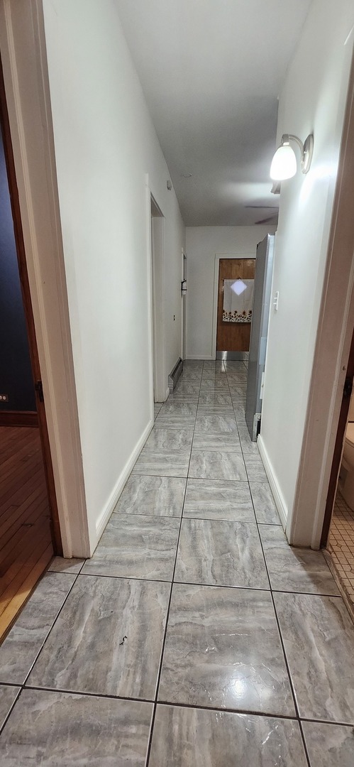 4450 West Altgeld Street, Unit 1 Chicago, IL 60639 - Photo 26 of 29 a view of a hallway view with staircase
