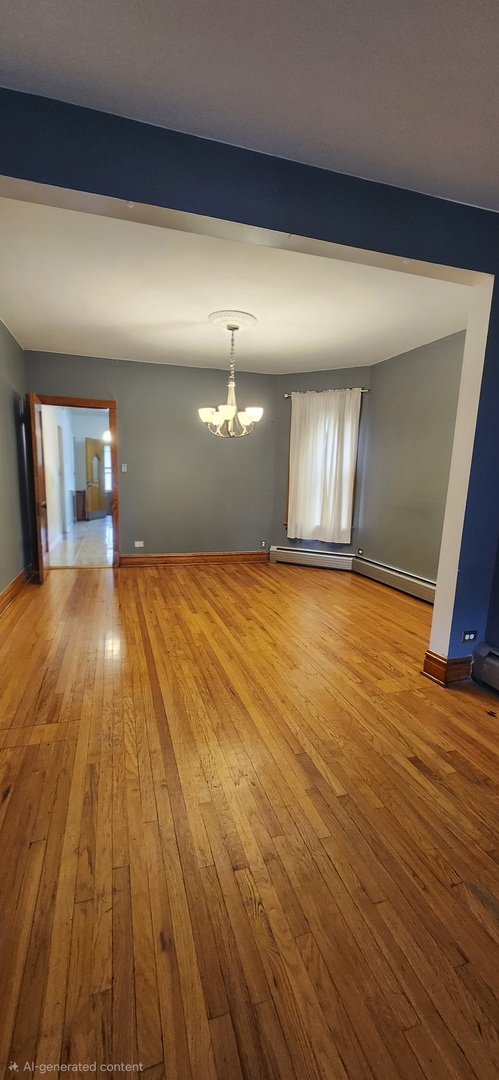 4450 West Altgeld Street, Unit 1 Chicago, IL 60639 - Photo 3 of 29 a view of empty room with wooden floor