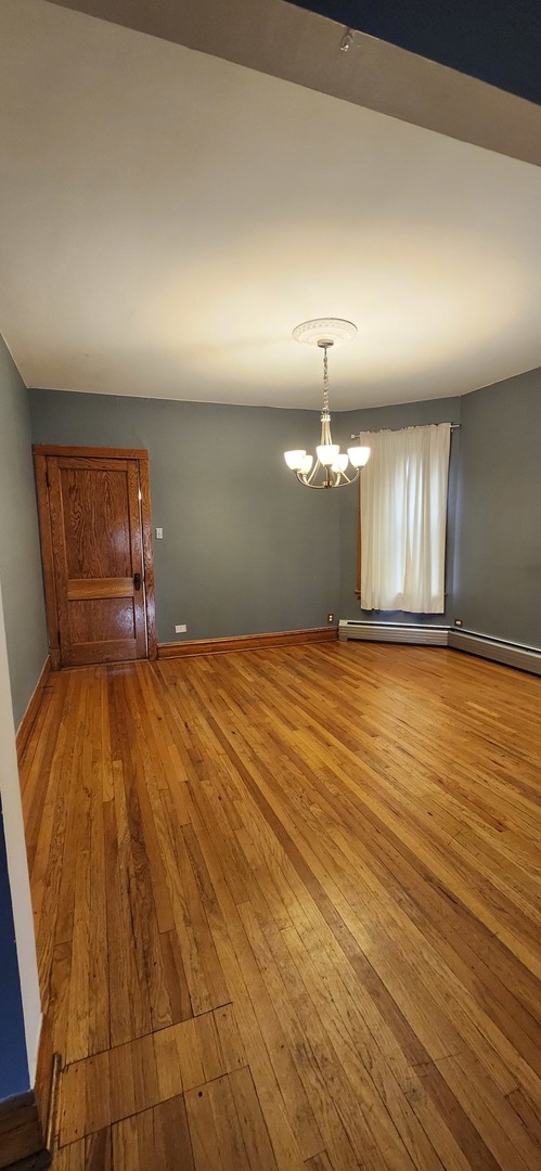 4450 West Altgeld Street, Unit 1 Chicago, IL 60639 - Photo 4 of 29 a view of an empty room