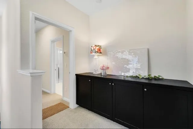 a white toilet sitting next to a white sink
