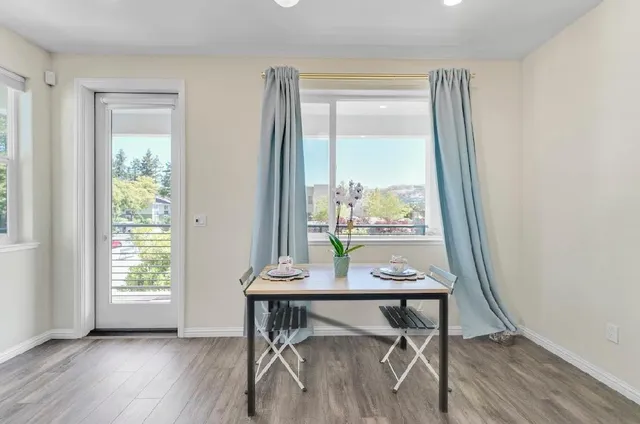 a bathroom with a granite countertop sink a mirror and shower