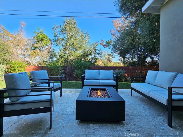 a view of a bench in the backyard