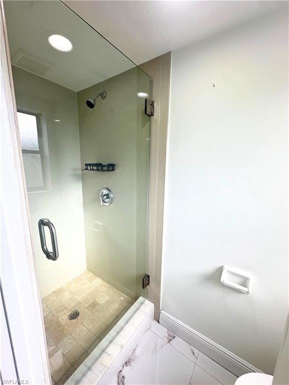 Undisclosed Address Naples, FL 34116 - Photo 11 of 16 a bathroom with a sink and a mirror