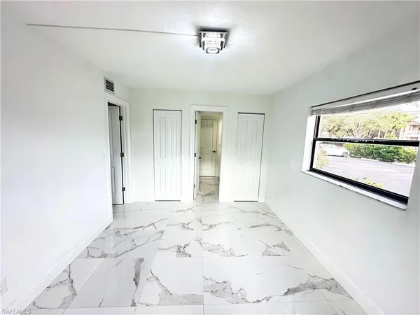 a bathroom with a shower and a sink