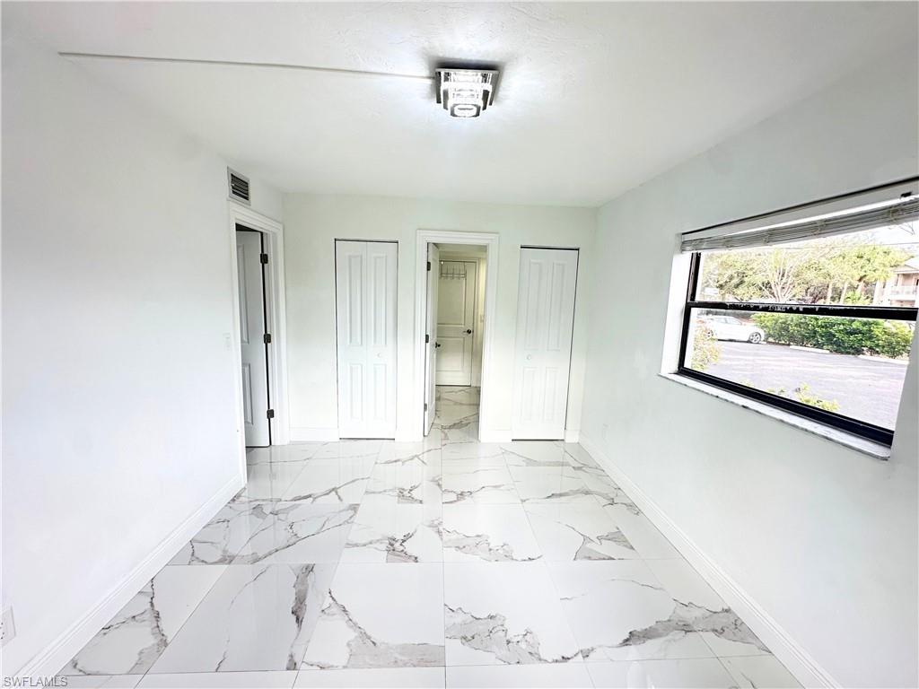 Undisclosed Address Naples, FL 34116 - Photo 12 of 16 a view of a room with a window