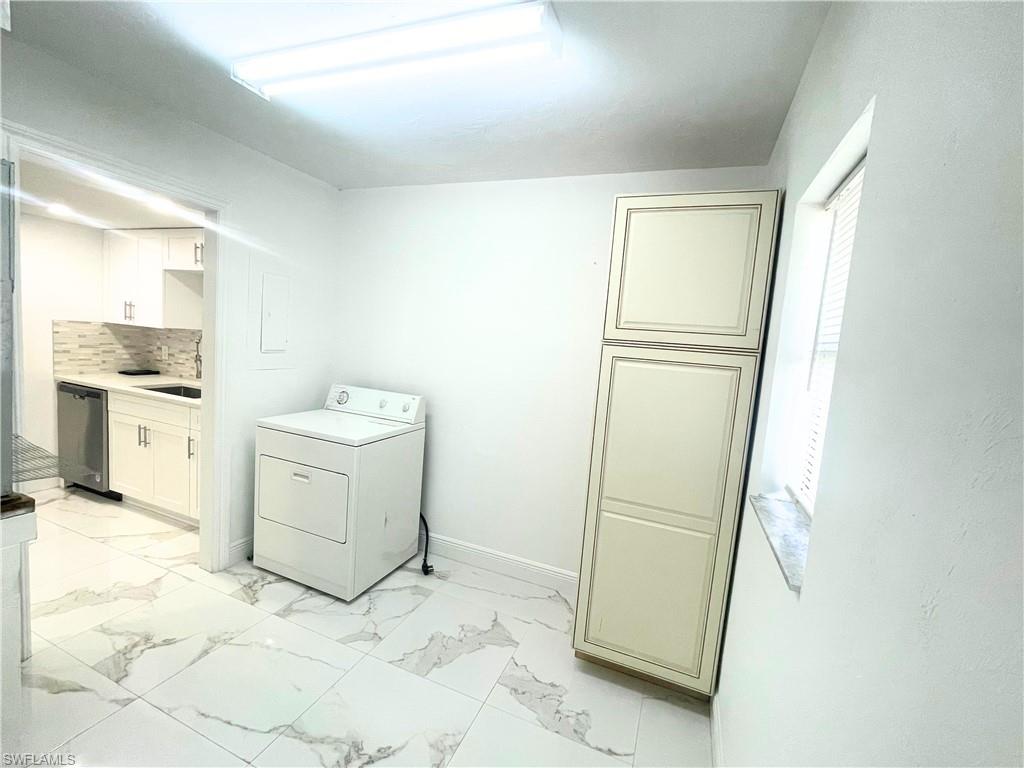 Undisclosed Address Naples, FL 34116 - Photo 15 of 16 a room with a stove and a refrigerator