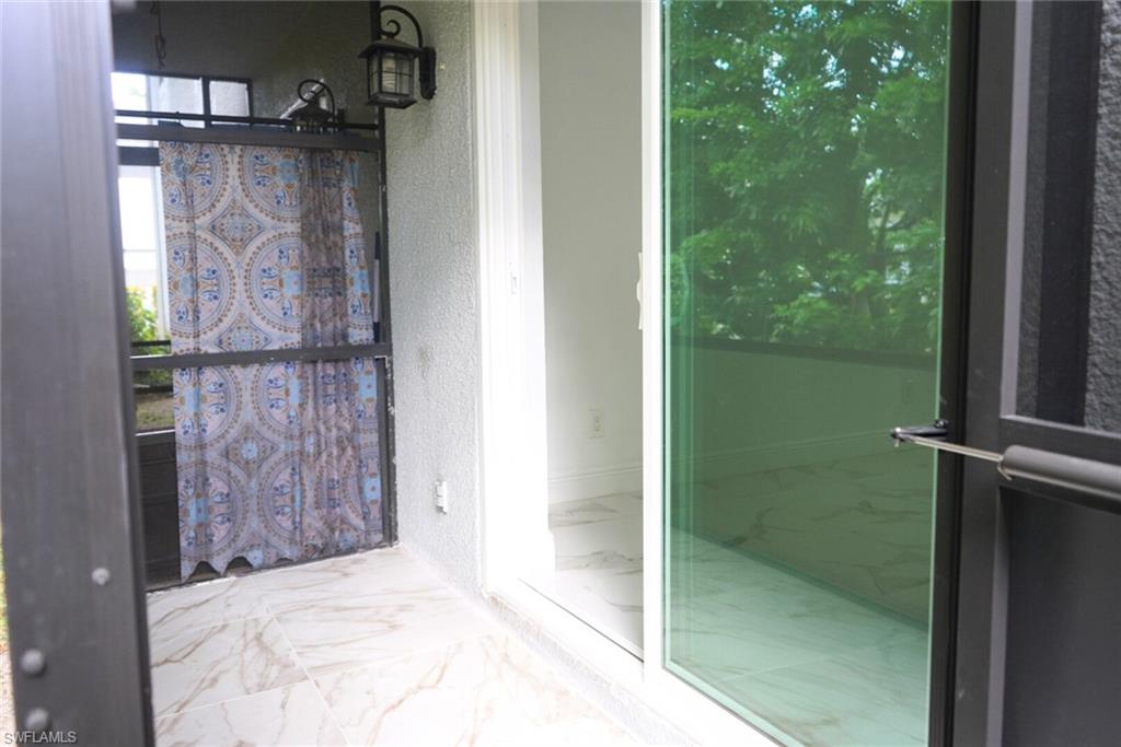 Undisclosed Address Naples, FL 34116 - Photo 16 of 16 a bathroom with a shower