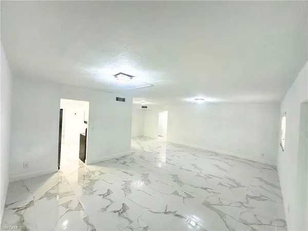 a view of a bathroom with a sink and a shower