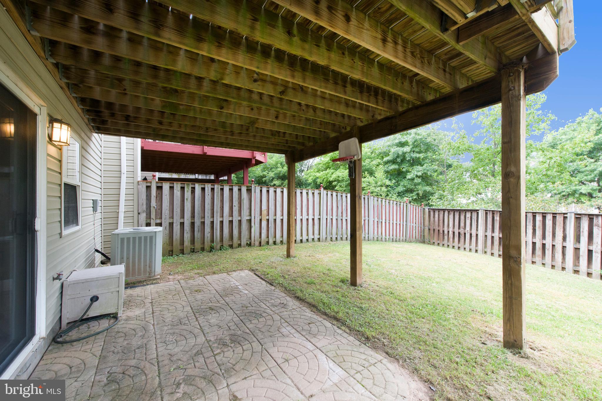 8701 Jarwood Road Baltimore, MD 21237 - Photo 32 of 35 Walk out to patio & fully fenced yard