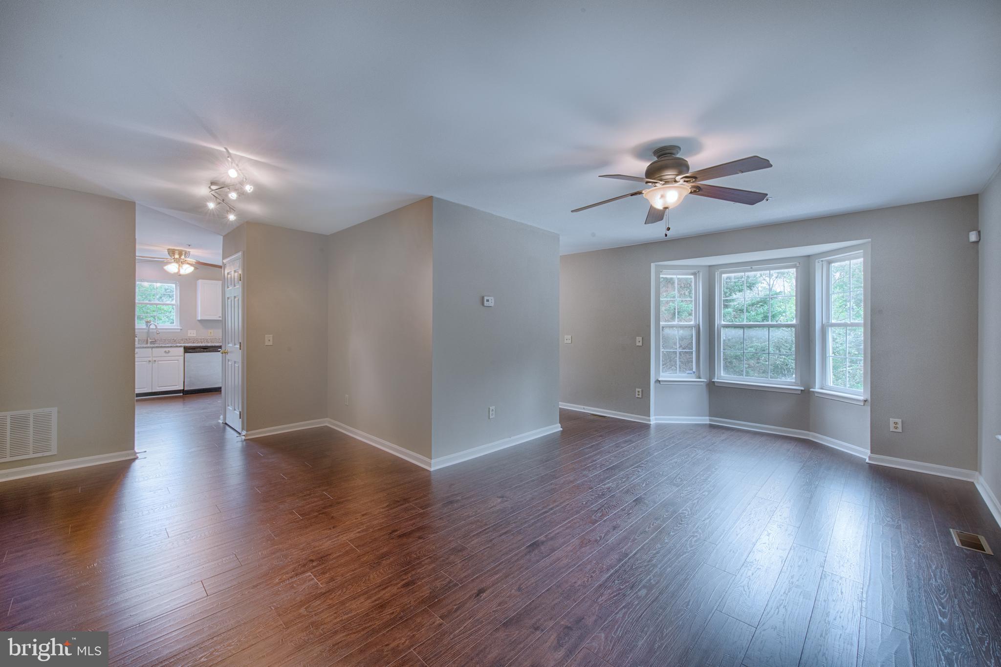 8701 Jarwood Road Baltimore, MD 21237 - Photo 8 of 35 Large dining/living room with ceiling fan