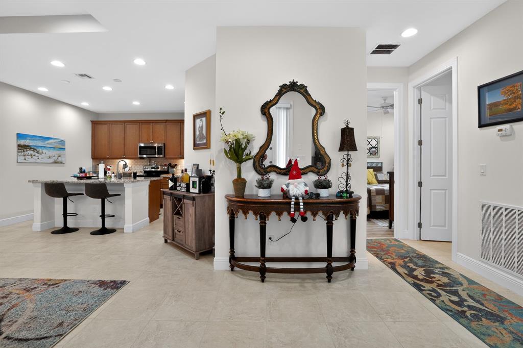 21044 Southwest Modena Way Port St. Lucie, FL 34986 - Photo 18 of 42 a view of a livingroom with furniture and a flat screen tv