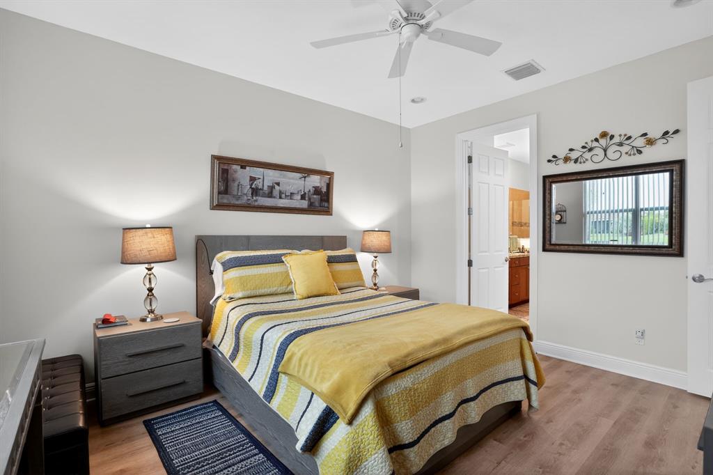 21044 Southwest Modena Way Port St. Lucie, FL 34986 - Photo 20 of 42 a bedroom with bed and window