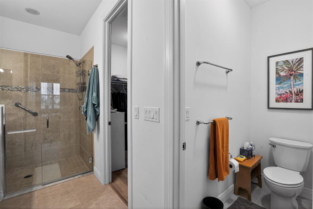 21044 Southwest Modena Way Port St. Lucie, FL 34986 - Photo 26 of 42 a bathroom with a toilet and a shower