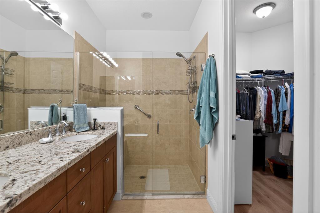 21044 Southwest Modena Way Port St. Lucie, FL 34986 - Photo 27 of 42 a bathroom with a granite countertop shower sink and mirror