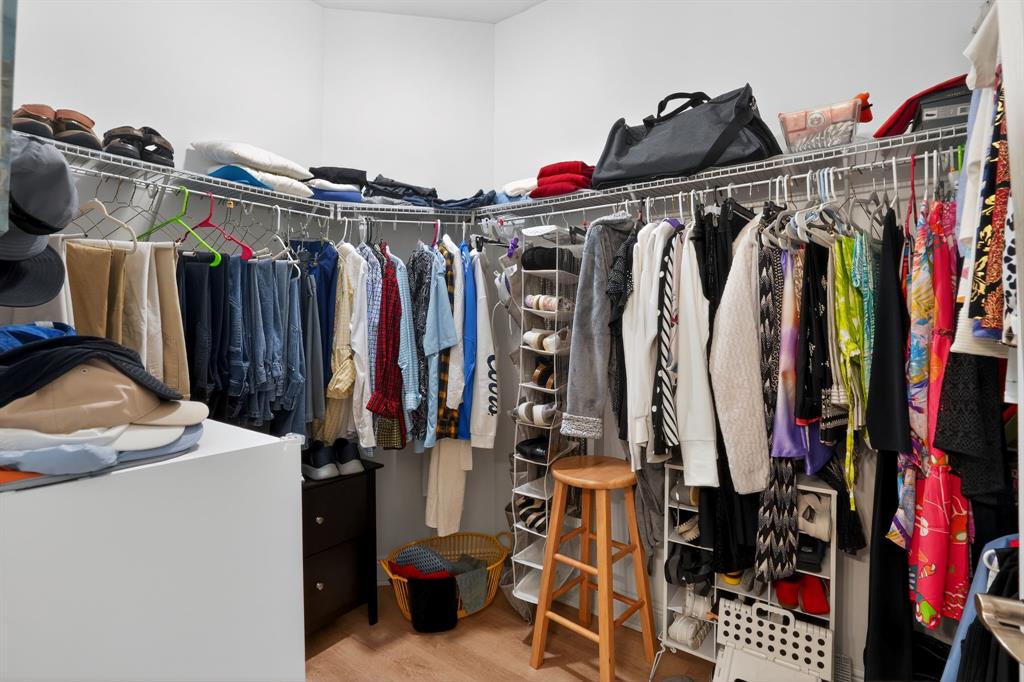 21044 Southwest Modena Way Port St. Lucie, FL 34986 - Photo 30 of 42 a view of walk in closet with clothes and shoes